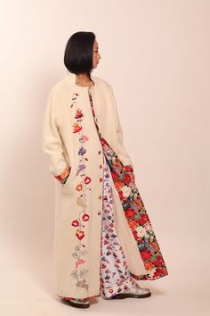 "White wool coat with floral embroidery and natural silk lining. Embellished with Swarovski crystals. Each jacket is hand embroidered and one of a kind. Collection \"MOON [mo:n]\" is inspired by floral embroidery from Muhu, a small island in Estonia with great handicraft traditions.  Each flower, bird and animal embroidered on the jacket has their own symbolic meaning. This jacket will be made especially for you and according to your measurements. Please allow 2-4  weeks for creating it. We ship Embroidered Coat Outfit, Wool Coat Embroidery, Fall Long Coat With Floral Embroidery, Embroidered Jackets For Women, Embroidered Wool Coat, Embroidery Runway, Winter Long Coat With Floral Embroidery, Ceremonial Embroidered Winter Outerwear, White Floral Embroidered Winter Outerwear