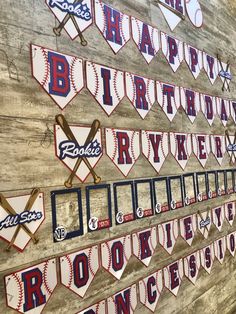 baseball themed happy birthday banner hanging on the side of a wooden wall in a dugout