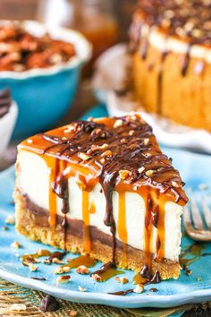 a slice of cheesecake on a plate with caramel drizzle and nuts