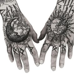 two hands that have tattoos on them