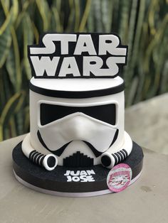 a star wars themed cake with a stormtrooper helmet on it's top