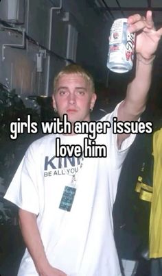 a man holding up a can of beer with the caption girls with anger issues love him