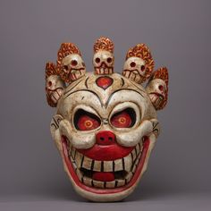 Wooden Carved Mask About Our Mask : With this carefully designed wooden carved mask, which is made of wood and has beautiful hand-painted features, you may embrace the diversity of cultures. This amazing object, which is 33 cm tall by 27 cm wide and weighs 1.094 kg, embodies the spiritual essence and traditional workmanship of Tibetan masks. Experts painstakingly craft and paint this mask using cultural symbolism and centuries-old skills. The vibrant colors and intricate designs evoke the rich h Traditional Masks For Theater And Festivals, Folk Mask, Traditional Theater Masks For Festivals, Tibetan Mask, Traditional Masks Culture, Meditation Area, Traditional Artwork, Tibet, Nepal