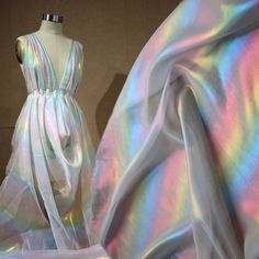 Wholesale Iridescent Magic Color Chiffon Fabric,Girl Dress Gauze,Wedding Decor,Fashion Designer Fabric, Note: This listing only is for 1 yard shiny fabric. Maybe a little color difference because of the light and different computer display. Width: About 150cm Length: This listing is for 1 yard. You will get a continue piece, if you buy more than 1 yard. Weight: About 60g / yard Feature: Iridescent Color Chiffon Fabric. Soft Smooth! You will see different color at different angles and light This Soft Summer Dress, Chifon Dress, Holographic Dress, Party Decor Diy, Iridescent Fabric, Dance Outfit, Shiny Fabric, Organza Dress, Rainbow Dress