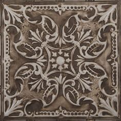 an intricately designed ceiling tile in brown and white colors, with decorative designs on the center