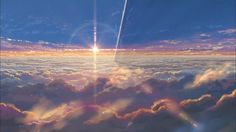 the sun shines brightly through clouds in this artistic photo taken from an airplane window