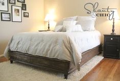 a bedroom with a bed, nightstands and pictures on the wall above it that says slant chic