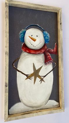 a painting of a snowman wearing a red hat and scarf