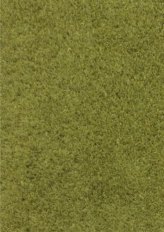 an image of a green carpet textured with grass