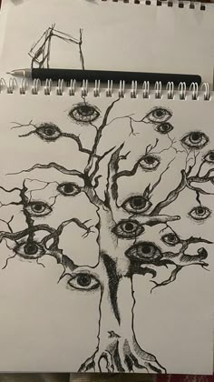 a drawing of a tree with eyes on it