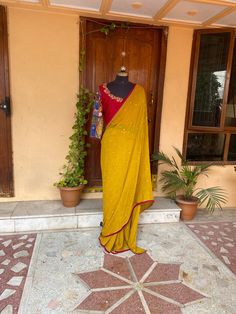 yellow buti georgette silk saree with hand embroidery Kalamkari blouse | silk saree with readymade blouse | sarees USA | pure light weight silk saree / red yellow saree with  stitched blouse / voggish / long sleeve maggam blouse      you are absolutely gonna fall in love with this unique modern  saree look with our stitched ready to wear blouses(includes the price) with a modern touch to them is perfect for your upcoming saree occassion that really makes you stand apart in crowd !!     You dont Semi-stitched Cotton Silk Pre-draped Saree With Mirror Work, Fitted Yellow Pre-draped Saree With Pallu, Unstitched Cotton Silk Saree With Mirror Work, Semi-stitched Cotton Silk Saree With Mirror Work, Bollywood Cotton Silk Saree With Mirror Work, Yellow Pre-draped Saree For Festivals, Festive Yellow Pre-draped Saree With Mirror Work, Cotton Silk Blouse Piece With Mirror Work, Yellow Silk Pre-draped Saree With Pallu