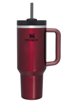 the red stainless steel travel mug has a black lid and is holding a straw in it