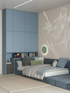 a room with a bed, couch and wall decal in the shape of a spider man