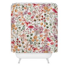 a shower curtain with flowers and leaves on it in pink, orange, yellow and white