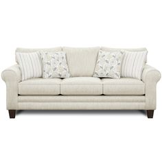 a white couch with two pillows on it