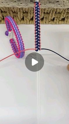 a video demonstrating how to make beaded bracelets with beads and wires on a table