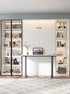 a room with bookshelves and a desk in it