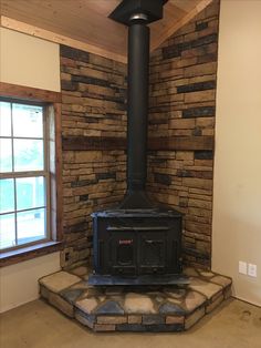 a wood burning stove sitting inside of a room