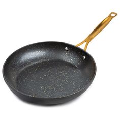 a black frying pan with gold speckles