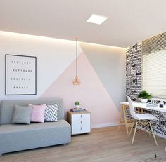 a living room with a couch, table and chair next to a wall covered in black and white letters