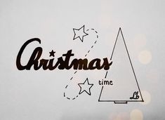 the word christmas time written in black ink on a white paper with stars around it