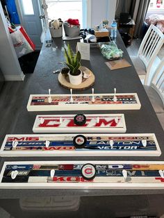 the table is set up with skis and other things on it, including a potted plant