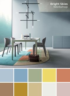 a dining room with blue walls, white table and chairs in color swatches on the floor