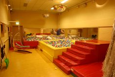 an indoor play area with lots of toys