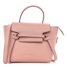 This is an authentic CELINE Grained Calfskin Pico Belt Bag in Vintage Pink. This chic tote is crafted of grained calfskin leather in a dusty pink with a structured and spacious silhouette. The bag features a leather strap top handle, optional shoulder strap with aged gold tone hardware, and a front-facing flap that is secured by decorative knotted straps. The facing flap opens top zipper into a suede leather interior. Celine Belt Bag, Bag Light, Strap Top, Bag Vintage, Strap Tops, Leather Interior, Dusty Pink, Belt Bag, Vintage Pink