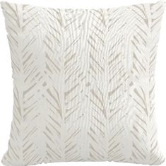 a white pillow with an abstract pattern on it