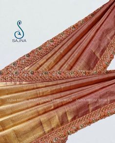 an orange and gold sari with sequins on it