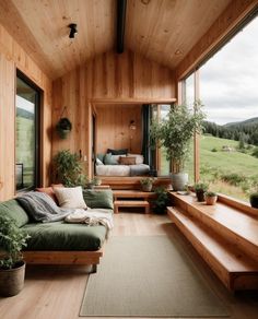 a living room filled with furniture and lots of windows