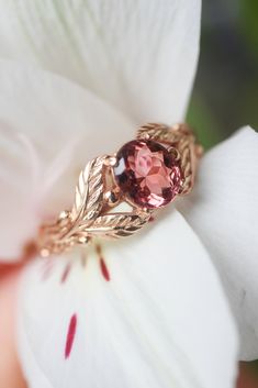 a close up of a ring on a flower