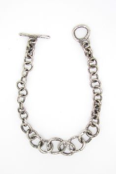 Silver Bracelet - The Round Chain Link Bracelet features a gradient of small to large hammered links, offering a lightweight feel and smooth touch. A thick toggle clasp ensures easy wear. Edgy Silver Jewelry, Chain Link Bracelet Silver, Artful Home, Silver Chain Bracelet, Bracelet Clasps, Bracelet Handmade, Toggle Clasp, Chain Link Bracelet, Easy Wear