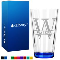 a glass with the word walker on it next to a box