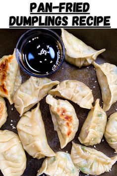 dumplings with dipping sauce in a frying pan