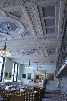 an ornately decorated dining room with chandeliers