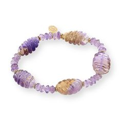 Rarities Carved Multigemstone Stretch Bracelet  Exotic gemstone stations carved in trendy swirl patterns give this easy-to-wear stretch bracelet a chic, stylish edge. Choose Ametrine or Fluorite stations.       Approx. 7-1/4"L x 1/2"W     Stamped .925; 22-24K yellow gold-plated     Stretch bracelet has carved gemstone ametrine stations with amethyst bead accents or fluorite stations with fluorite bead accents     Yellow gold-plated spacer beads and quality tag     Beads strung on jeweler's elast Faceted Amethyst Beads Bracelets, Luxury Purple Bracelets With Gemstone Accents, Purple Faceted Amethyst Beaded Bracelets, Purple Faceted Amethyst Bracelets, Ametrine Bracelet, Amethyst Beads, Swirl Pattern, Bead Stringing, Rarity