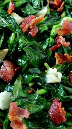 spinach salad with bacon and cheese on top