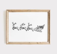 a black and white drawing of santa's sleigh flying through the sky