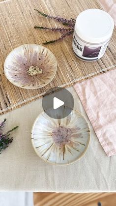 a table topped with plates covered in flowers