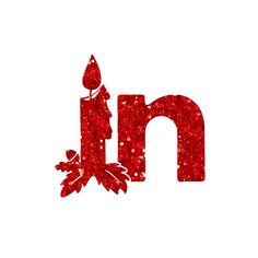 the letter n is made up of red glitter and has leaves on it, as well as a candle