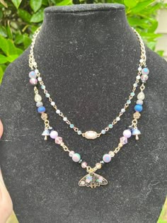 I handcrafted a beautiful double strand moth necklace. It is made with some upcycled materials. It is adjustable and ready to ship. Necklaces Beads, Keychain Designs, Moth Necklace, Bead Ideas, Upcycled Materials, Keychain Design, Charm Necklaces, Double Ring, Natural Materials