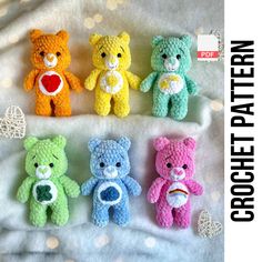 four crocheted teddy bears sitting next to each other on a white sheet with polka dots