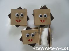 four brown paper bags with eyes and noses on them