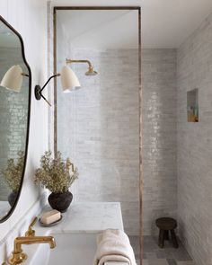 a bathroom with a sink, mirror and towel rack