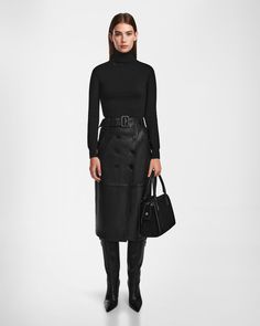 Make a statement with the COLETTE by RUDSAK, a women's luxe supple A-line leather skirt featuring a button front and waist belt. Designed for a flattering fit, this skirt seamlessly blends sophistication with modern elegance. The premium leather offers a luxurious feel and elegant drape, while the waist belt accentuates your silhouette. Perfect for both day and night, the COLETTE skirt is a versatile addition to any fashion-forward woman's wardrobe, ensuring timeless appeal and effortless style. Parka Vest, Moto Biker Jacket, Puffer Parka, Wool Trench Coat, Leather Midi Skirt, Outerwear Outfit, Knitwear Dress, Sweaters And Leggings, Women's Wardrobe