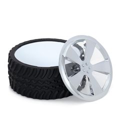 two black tires with chrome rims on white background