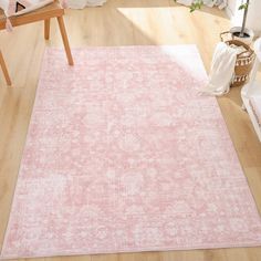 a pink area rug in a living room