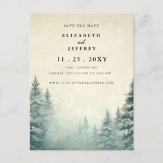 save the date card with pine trees in foggy watercolor on parchmented paper